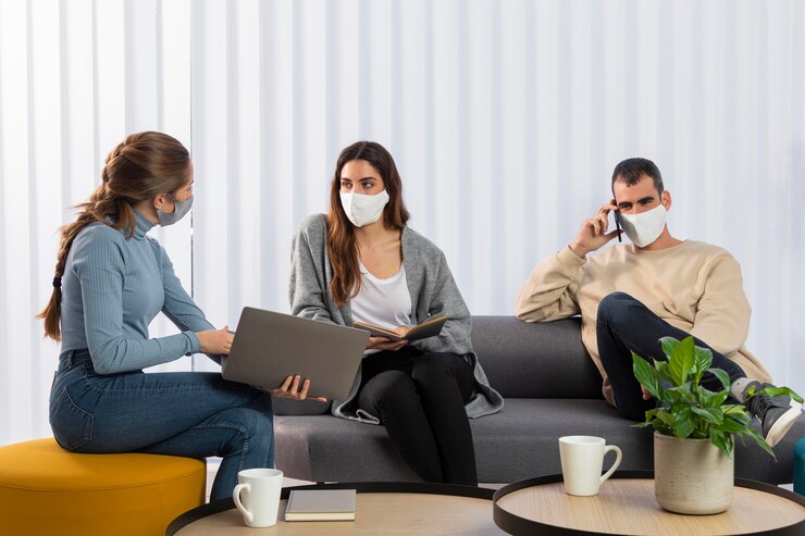 Medium shot coworkers on couch