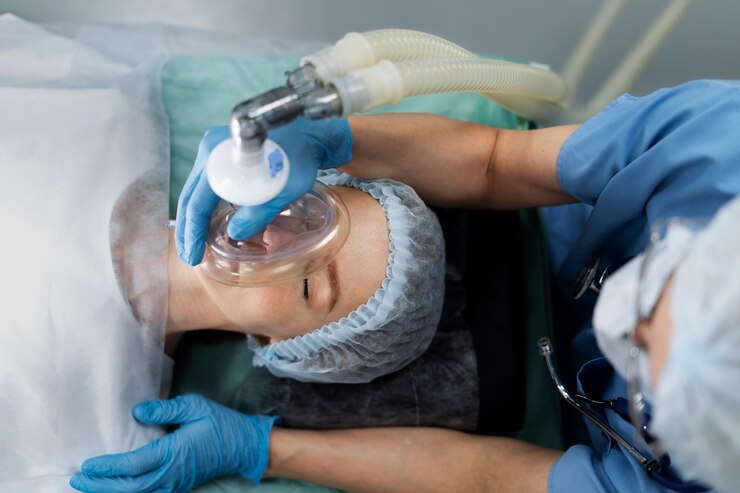 Nurse putting oxygen mask to patient